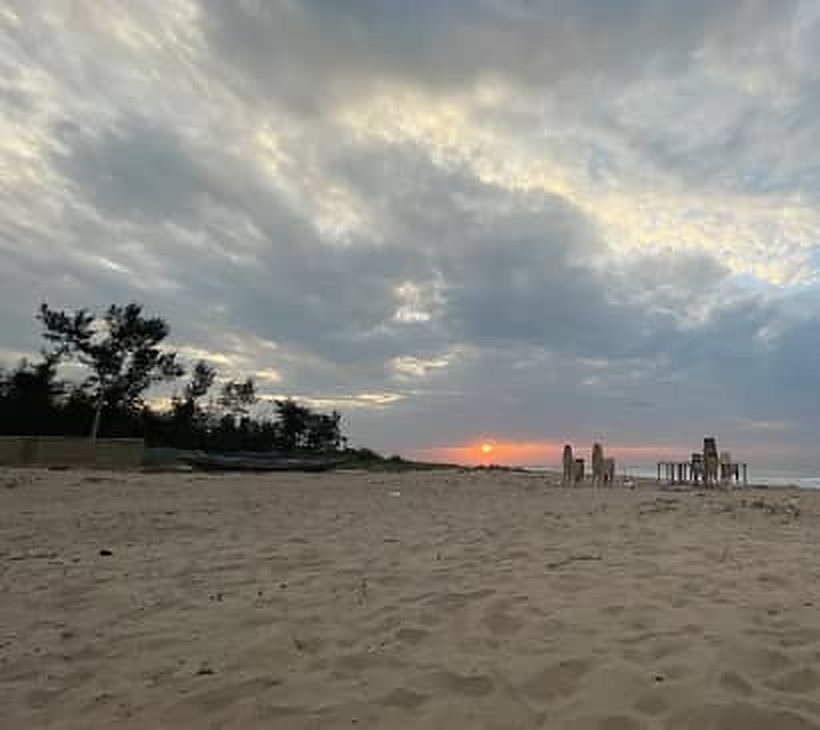 Sun low over the sand on the beach beside Myra Golden Beach Resort