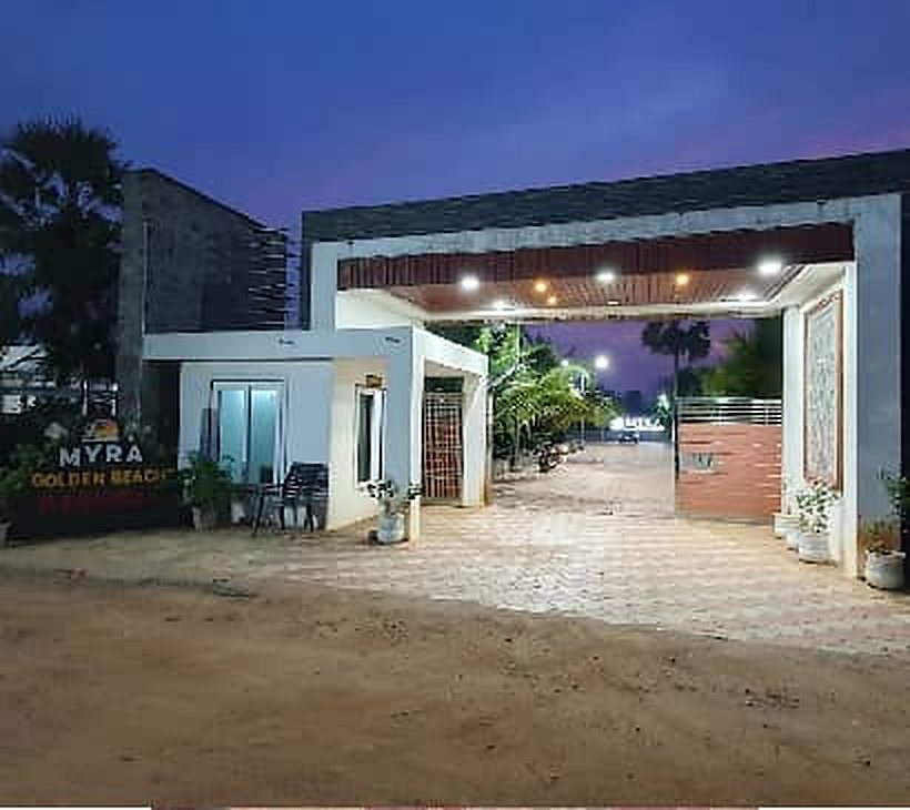 Resort entrance gate lit up at dusk